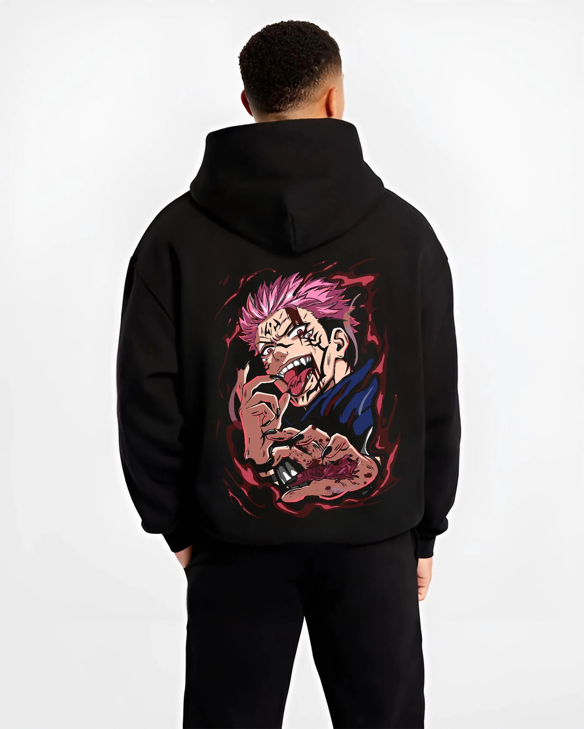 Black hoodie worn by male model from the back featuring Ryomen Sukuna red cursed energy Jujutsu Kaisen artwork.