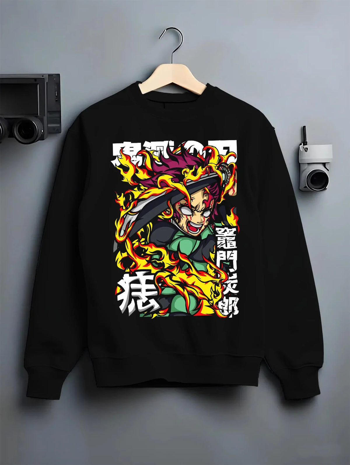 Black crewneck sweatshirt on hanger featuring Yoriichi Tsugikuni Sun Breathing flame aura Demon Slayer artwork.