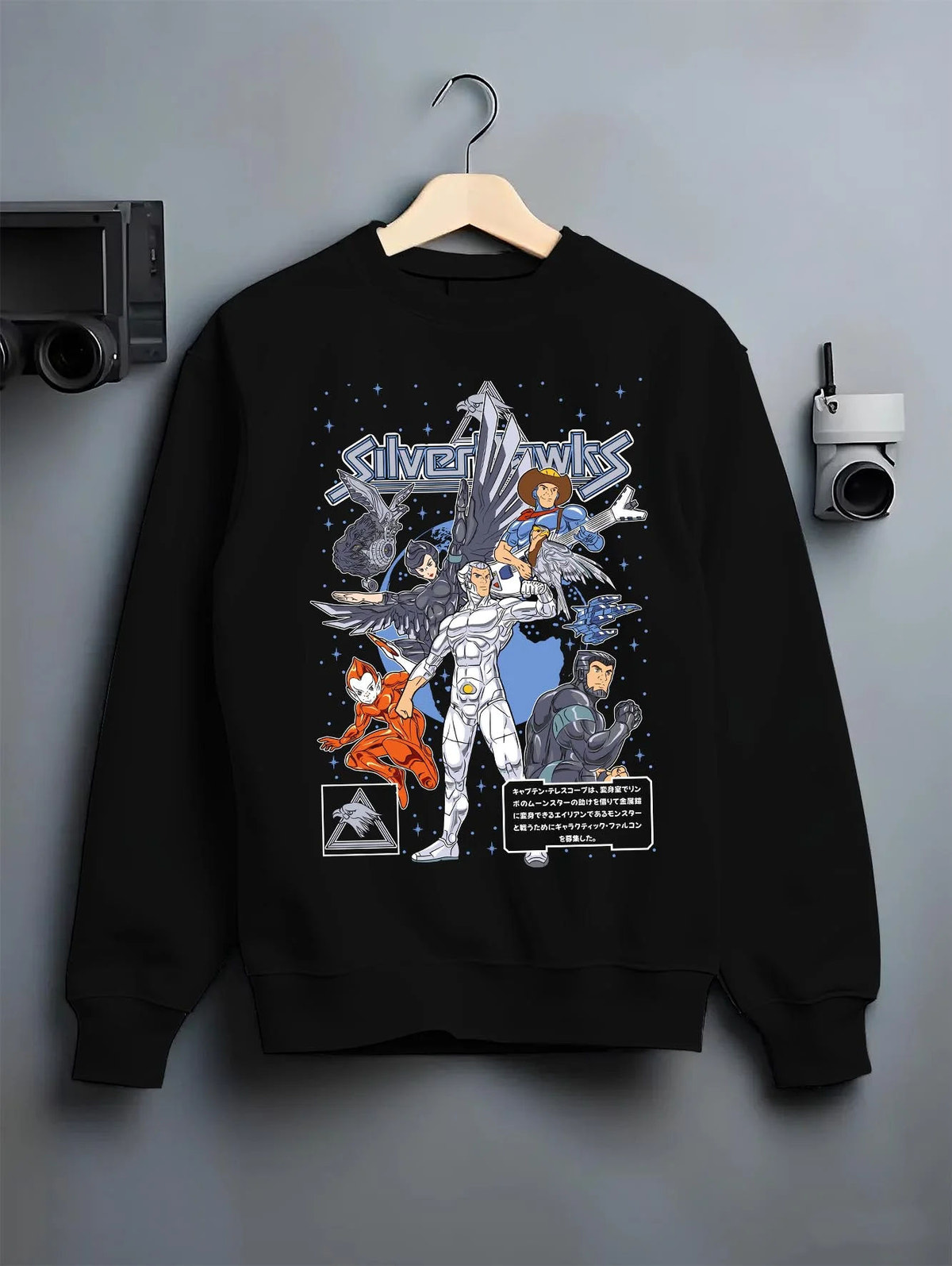 Black crewneck sweatshirt on hanger featuring SilverHawks space hero team artwork.