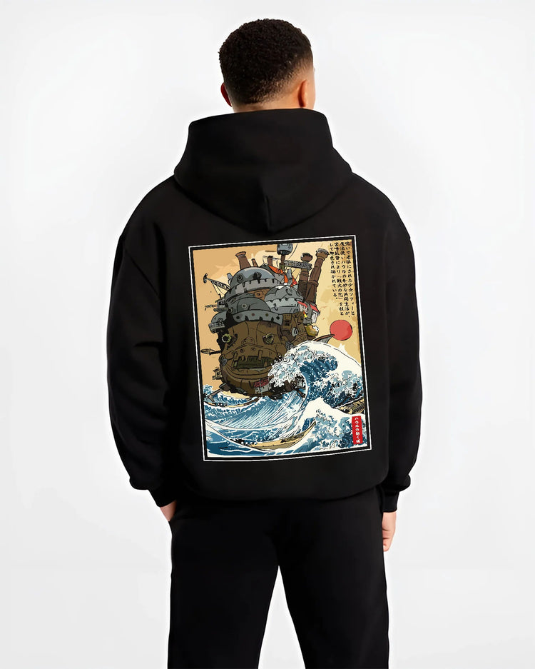 Black hoodie model back view showing Howl's Moving Castle from Studio Ghibli: walking castle with wave motif