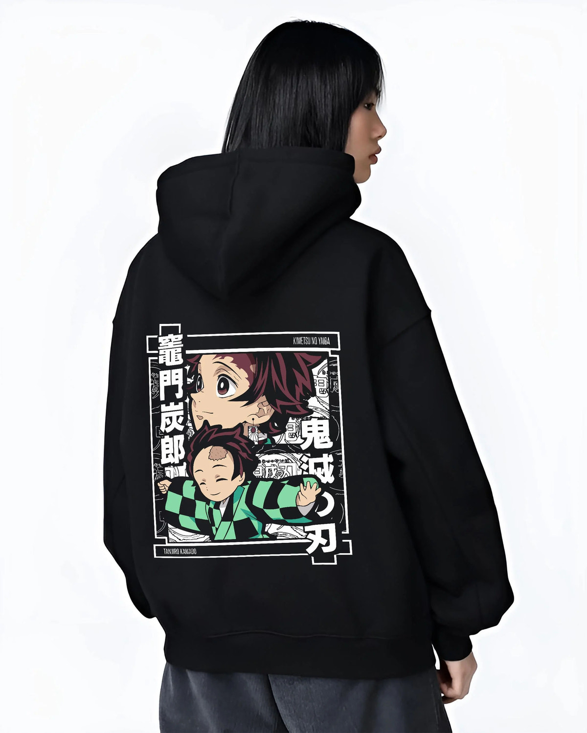 Black hoodie worn by female model from the back featuring Tanjiro Kamado chibi family Demon Slayer artwork.