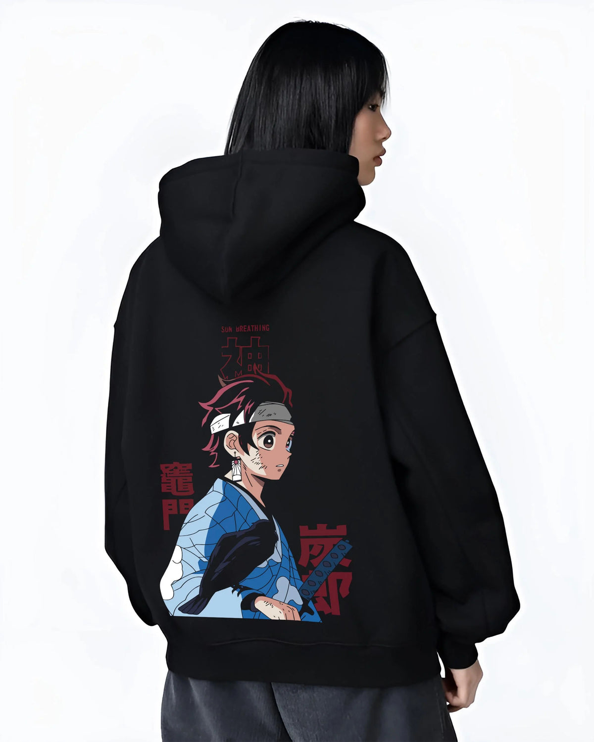 Black hoodie worn by female model from the back featuring Tanjiro Kamado Demon Slayer Mark artwork.