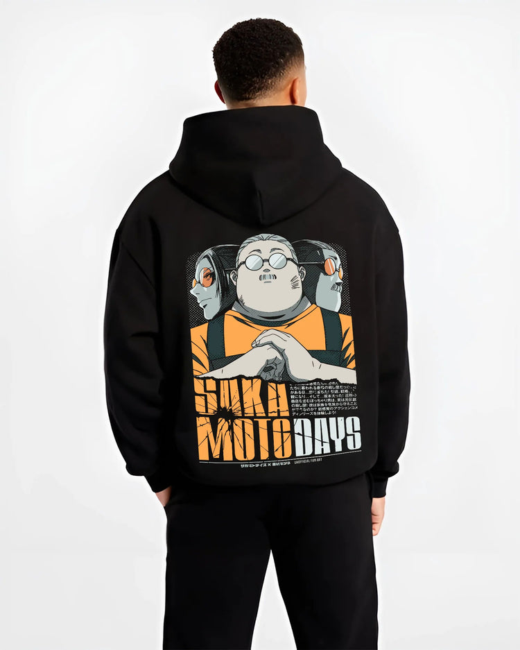 Black hoodie model back view showing Taro Sakamoto from Sakamoto Days: orange work uniform