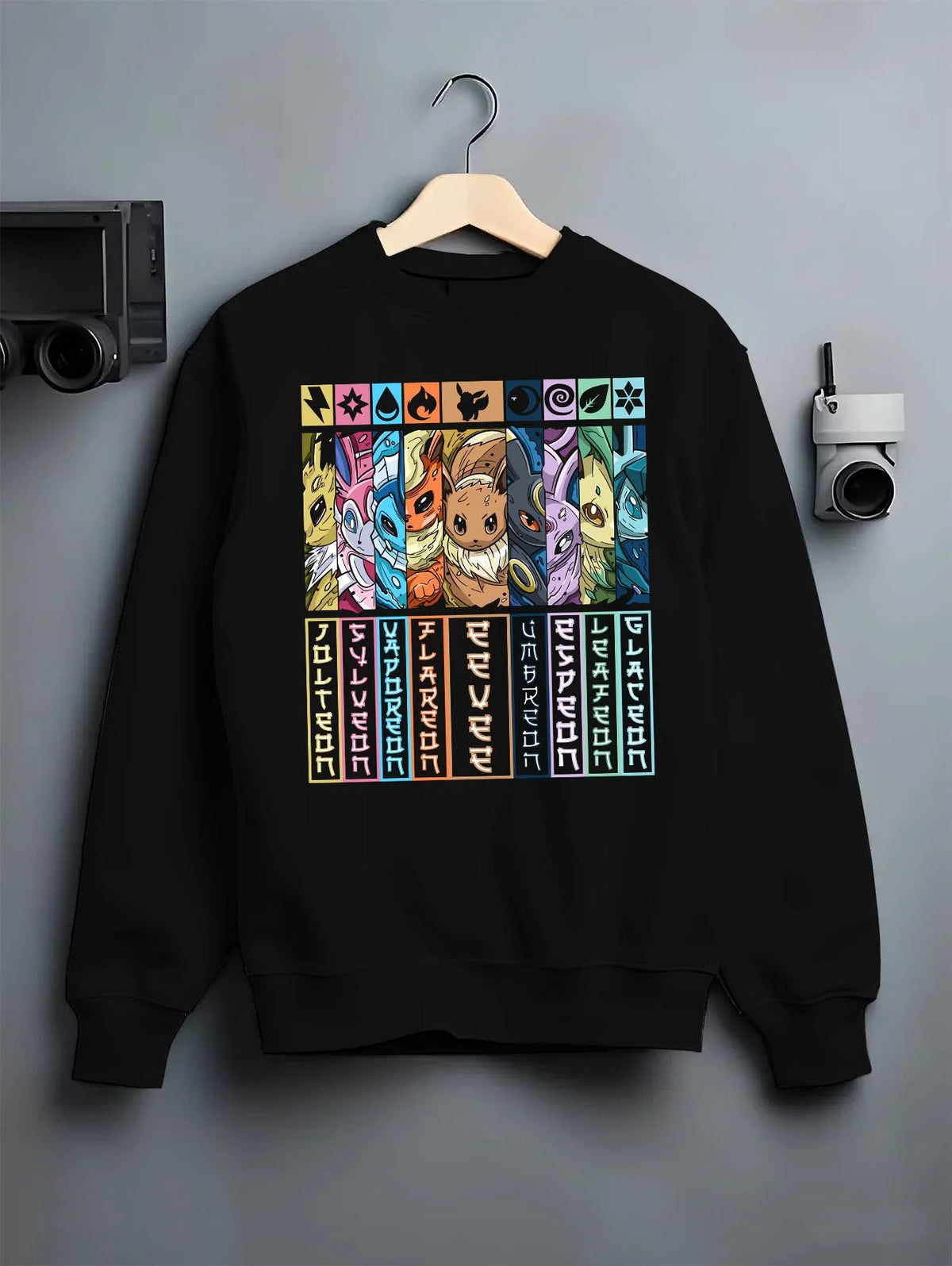 Black crewneck sweatshirt on hanger featuring Eevee evolutions element types Pokemon artwork.
