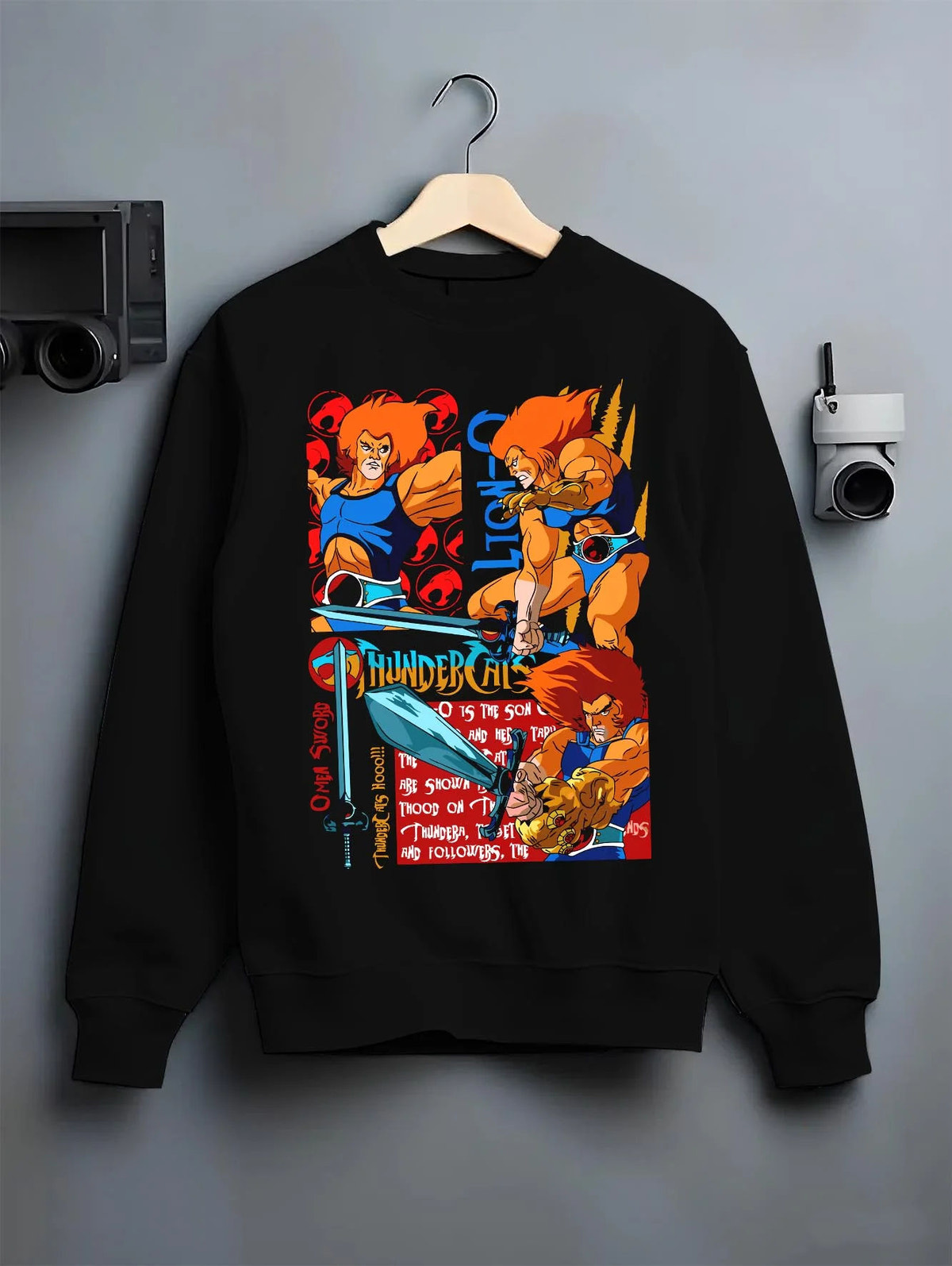 Black crewneck sweatshirt on hanger featuring Lion-O Sword of Omens team ThunderCats artwork.