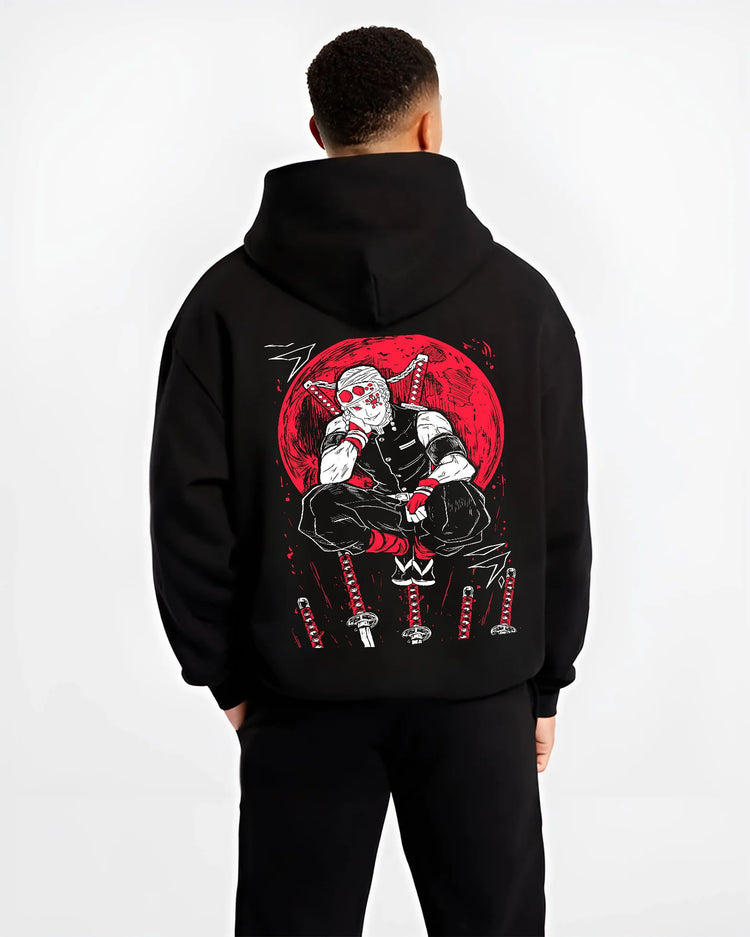 Black hoodie model back view showing Tengen Uzui from Demon Slayer: seated magenta/red print