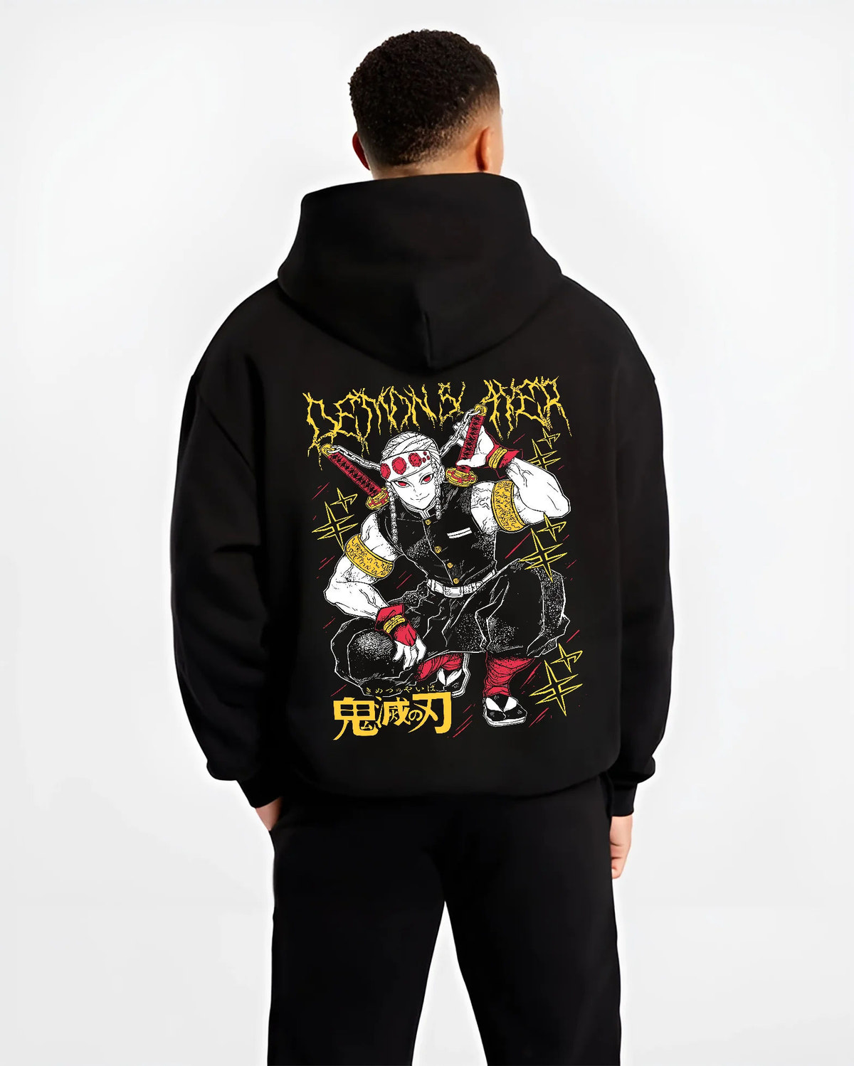 Black hoodie model back view showing Tengen Uzui from Demon Slayer: crouching yellow/black print