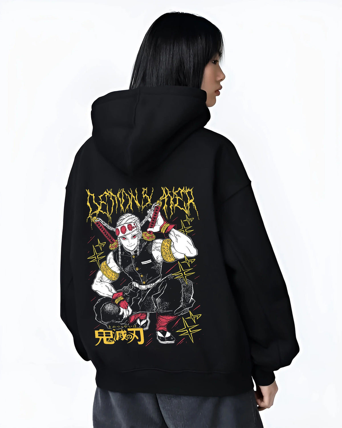 Black hoodie female model back view showing Tengen Uzui from Demon Slayer: crouching yellow/black print