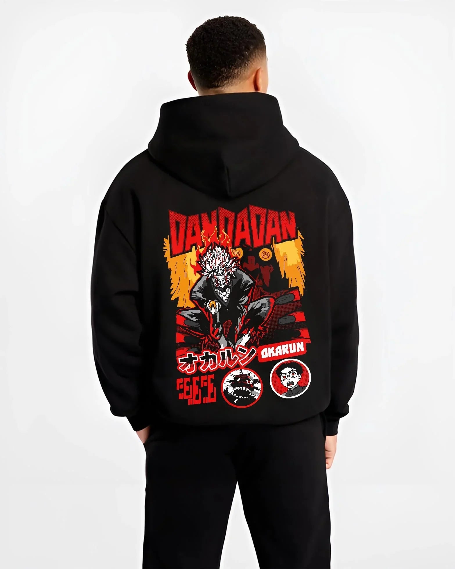 Black hoodie worn by male model, back view with Okarun Hoodie Dandadan Possessed Spirit Alien Fight graphic Okarun anime design.