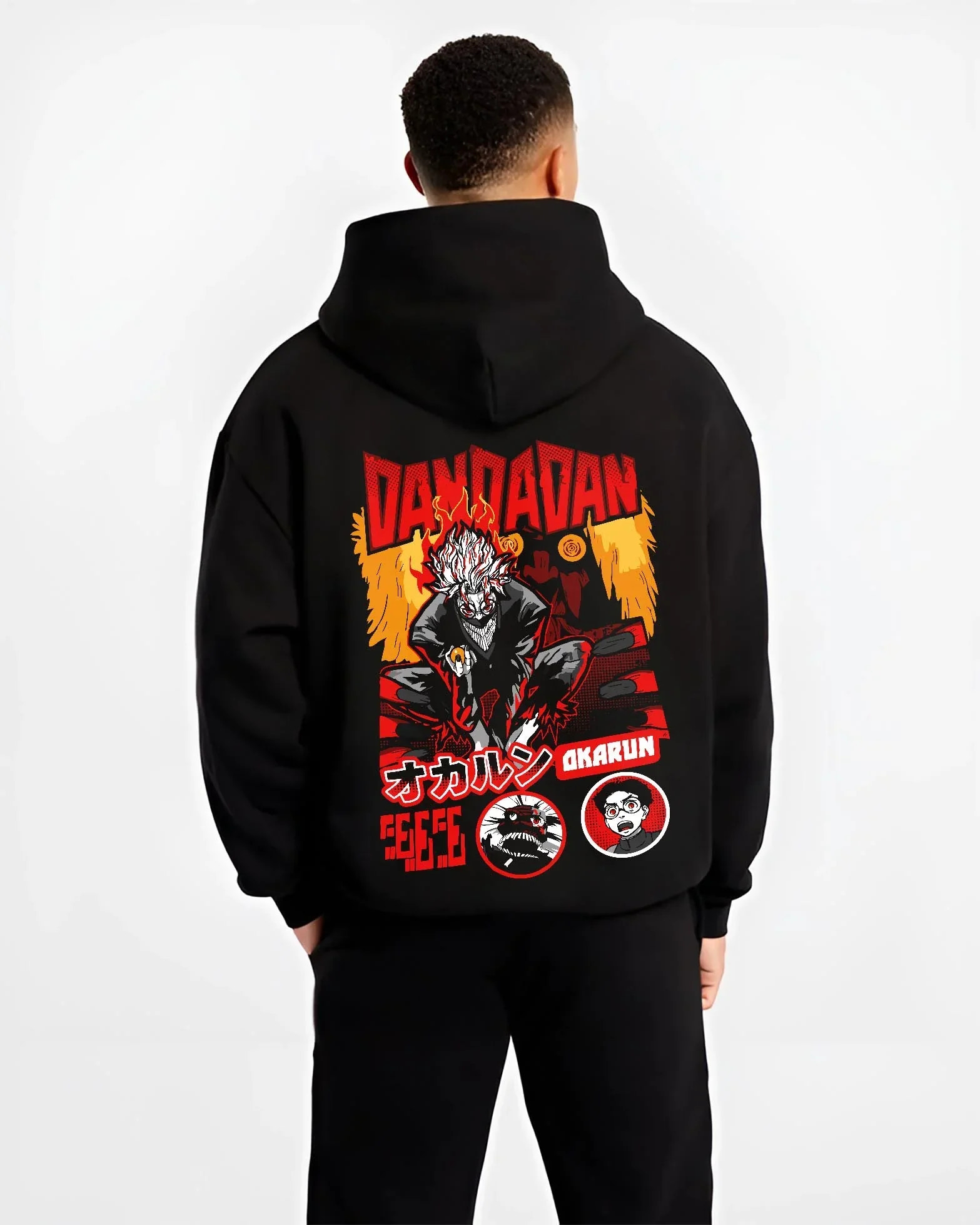 Black hoodie worn by male model, back view with Okarun Hoodie Dandadan Possessed Spirit Alien Fight graphic Okarun anime design.