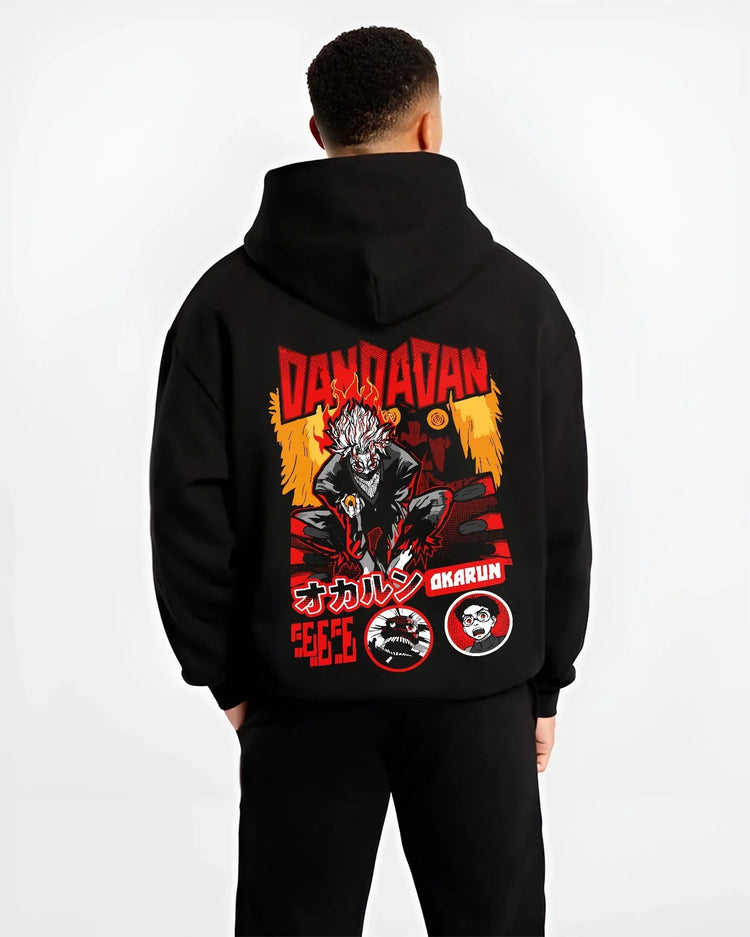 Black hoodie worn by male model, back view with Okarun Hoodie Dandadan Possessed Spirit Alien Fight graphic Okarun anime design.