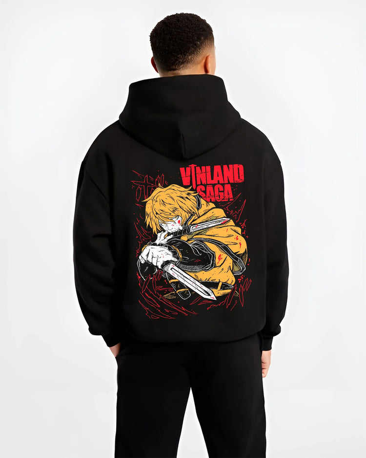 Black hoodie model back view showing Thorfinn from Vinland Saga: golden-haired swordsman profile