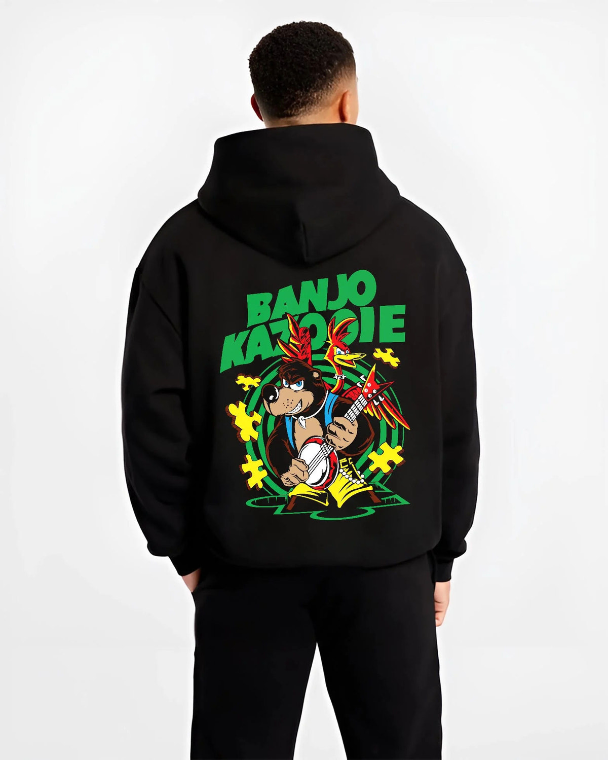 Black hoodie worn by male model from the back featuring Banjo and Kazooie bear bird adventure Banjo-Kazooie artwork.
