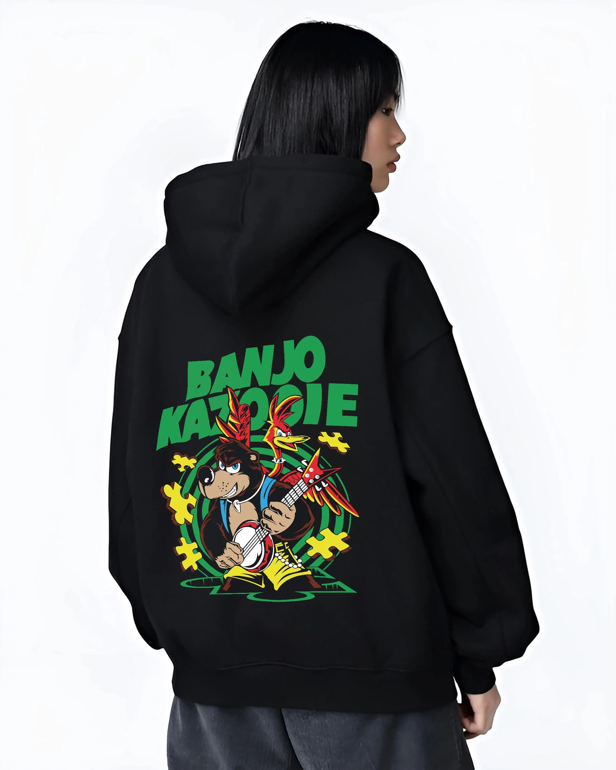 Black hoodie worn by female model from the back featuring Banjo and Kazooie bear bird adventure Banjo-Kazooie artwork.