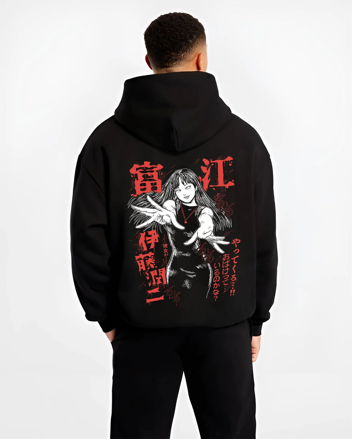 Black hoodie model back view showing Tomie Kawakami from Junji Ito: raised hands and horror portrait