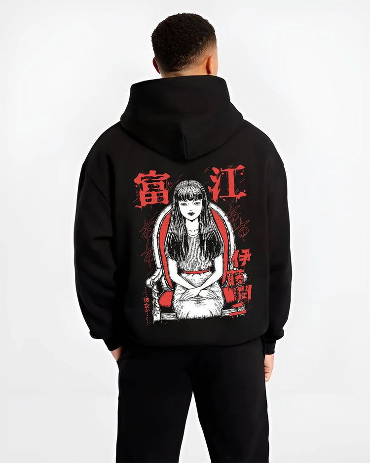 Black hoodie model back view showing Tomie Kawakami from Junji Ito: horror manga long-haired girl