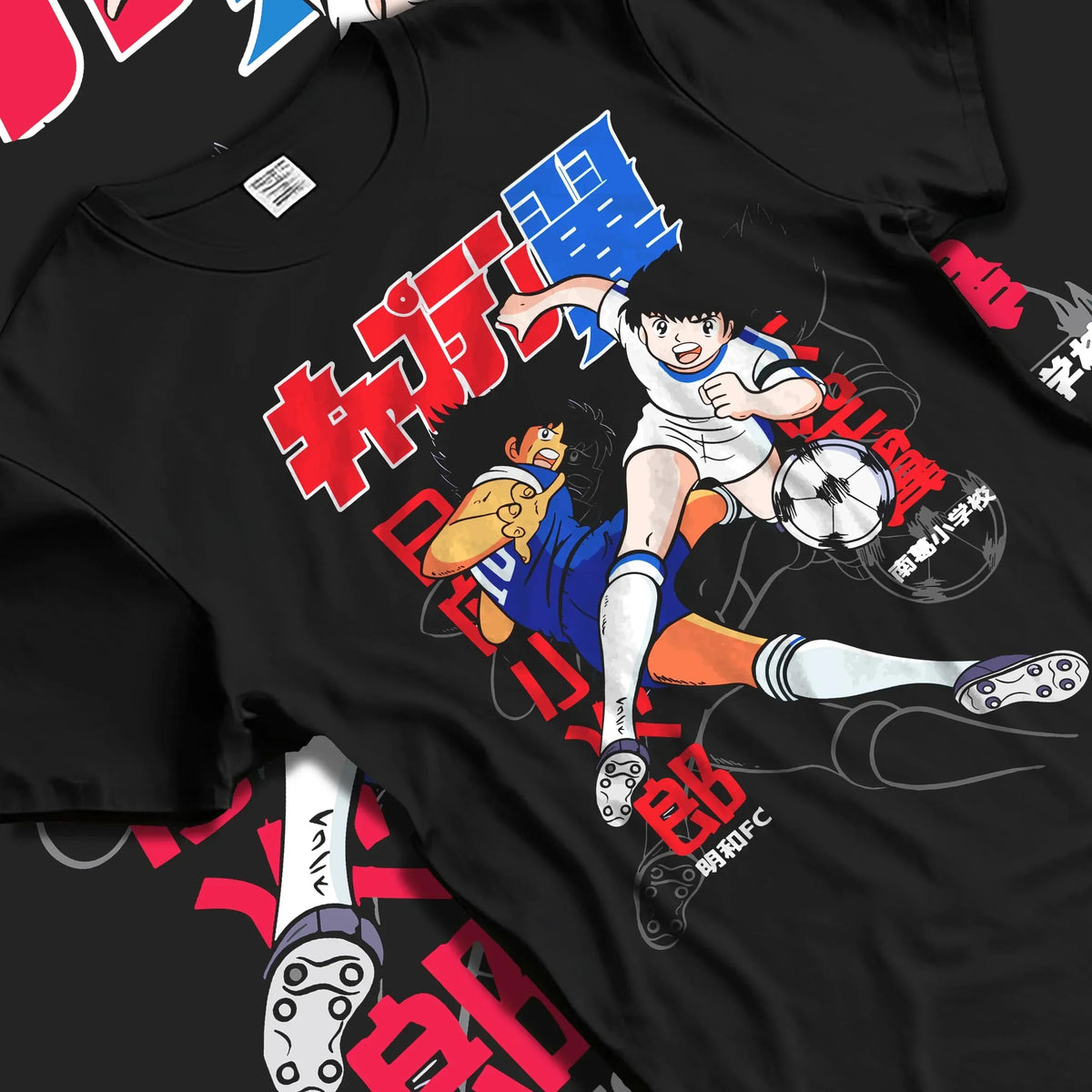 Black T-shirt laid flat with natural folds with Tsubasa Duo Hoodie Captain Tsubasa Soccer Team Play graphic streetwear graphic.