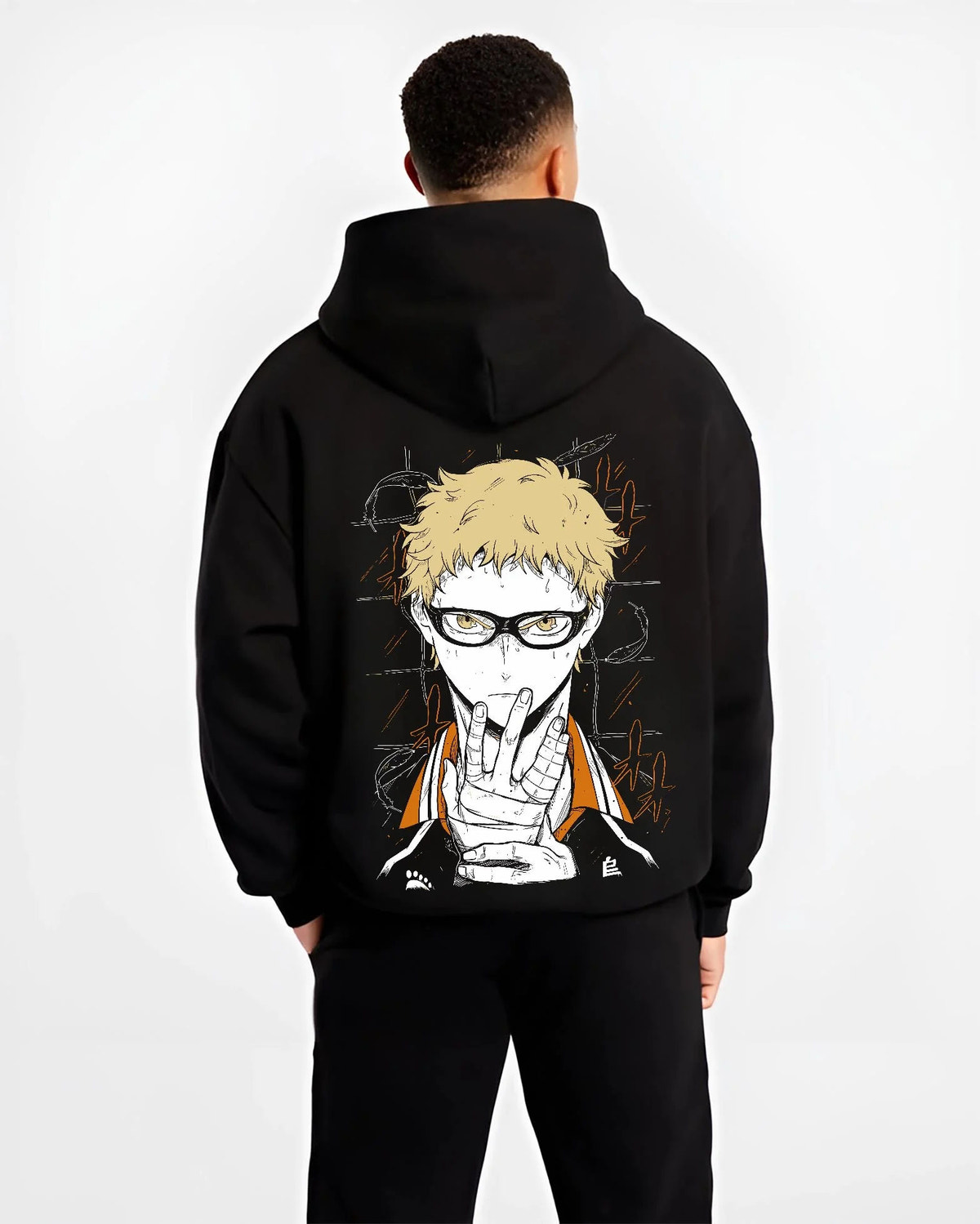 Black hoodie worn by male model from the back featuring Kei Tsukishima Karasuno blocker Haikyuu artwork.