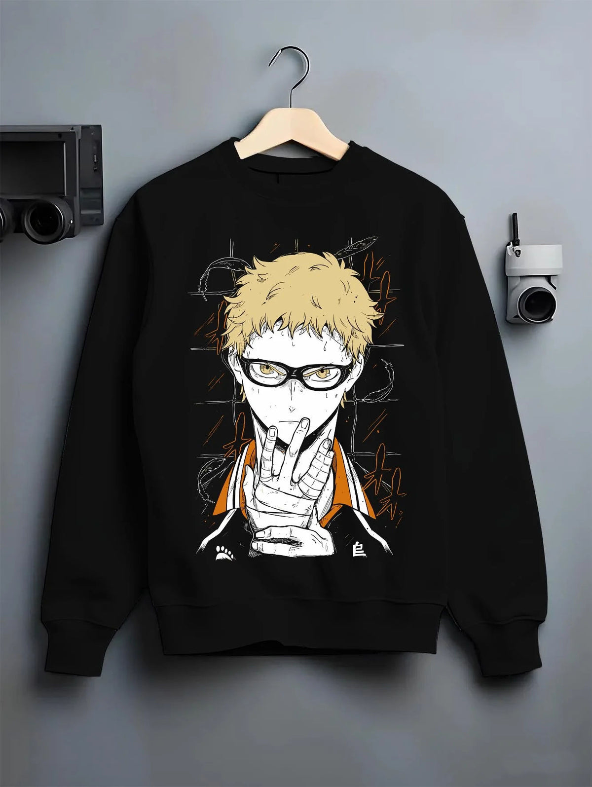 Black crewneck sweatshirt on hanger featuring Kei Tsukishima Karasuno blocker Haikyuu artwork.