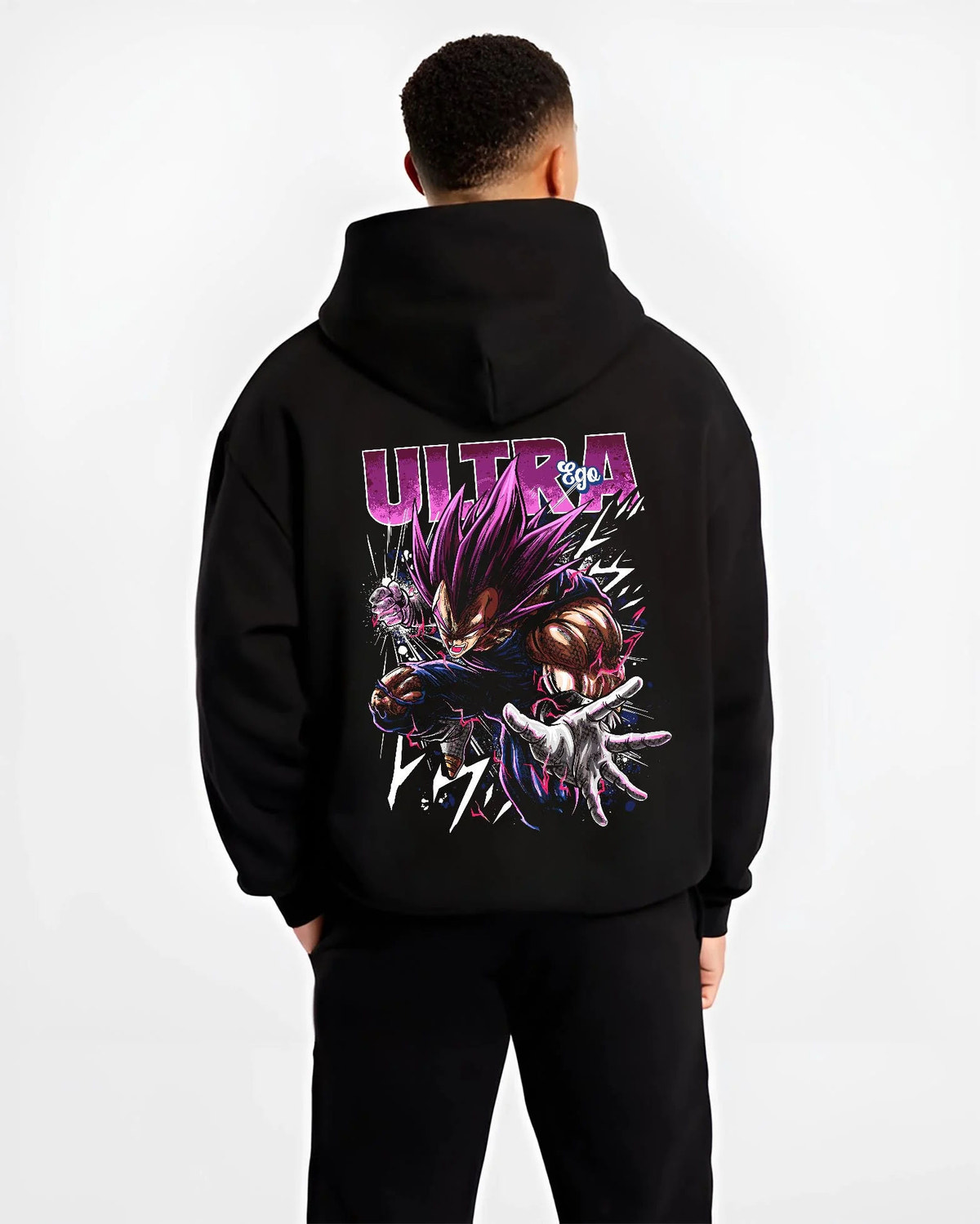 Black hoodie worn by male model from the back featuring Vegeta Ultra Ego purple battle power Dragon Ball Super artwork.
