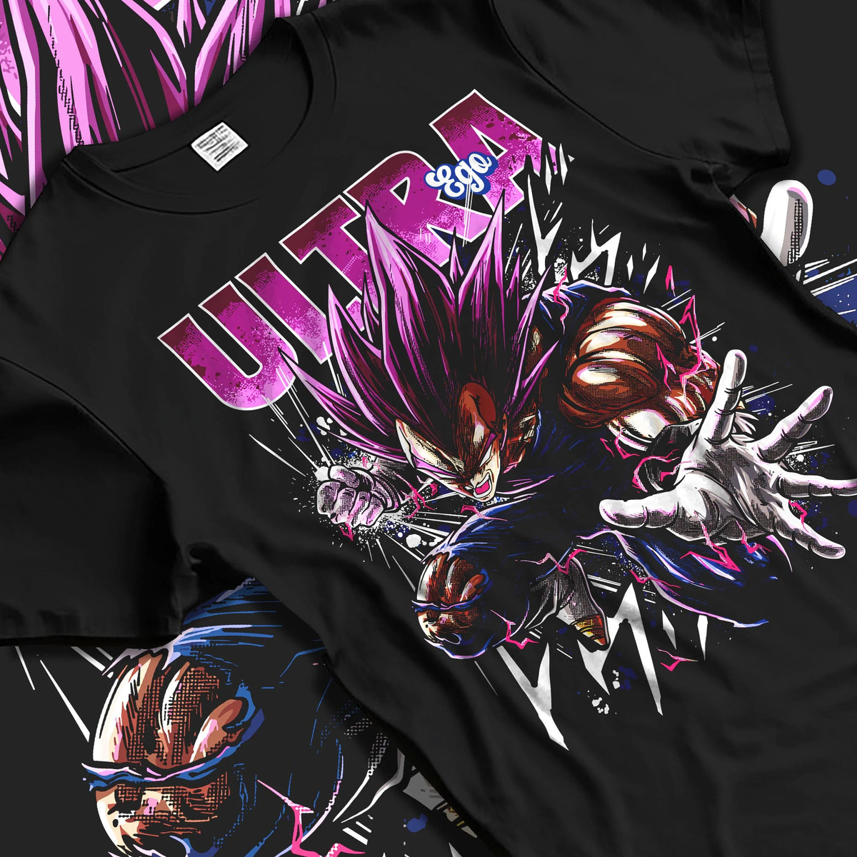 Black T-shirt laid flat with natural folds featuring Vegeta Ultra Ego purple battle power Dragon Ball Super artwork.
