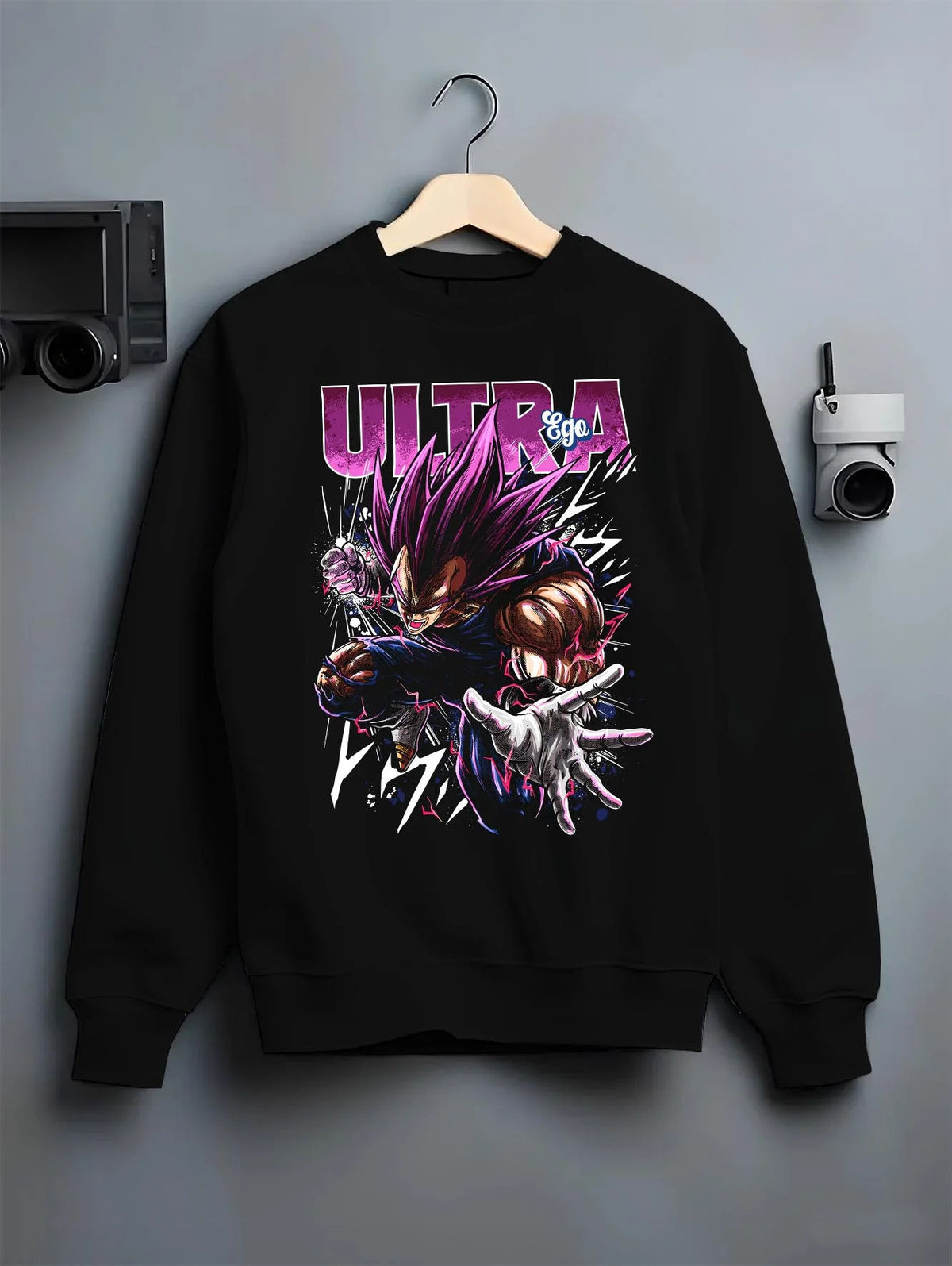 Black crewneck sweatshirt on hanger featuring Vegeta Ultra Ego purple battle power Dragon Ball Super artwork.