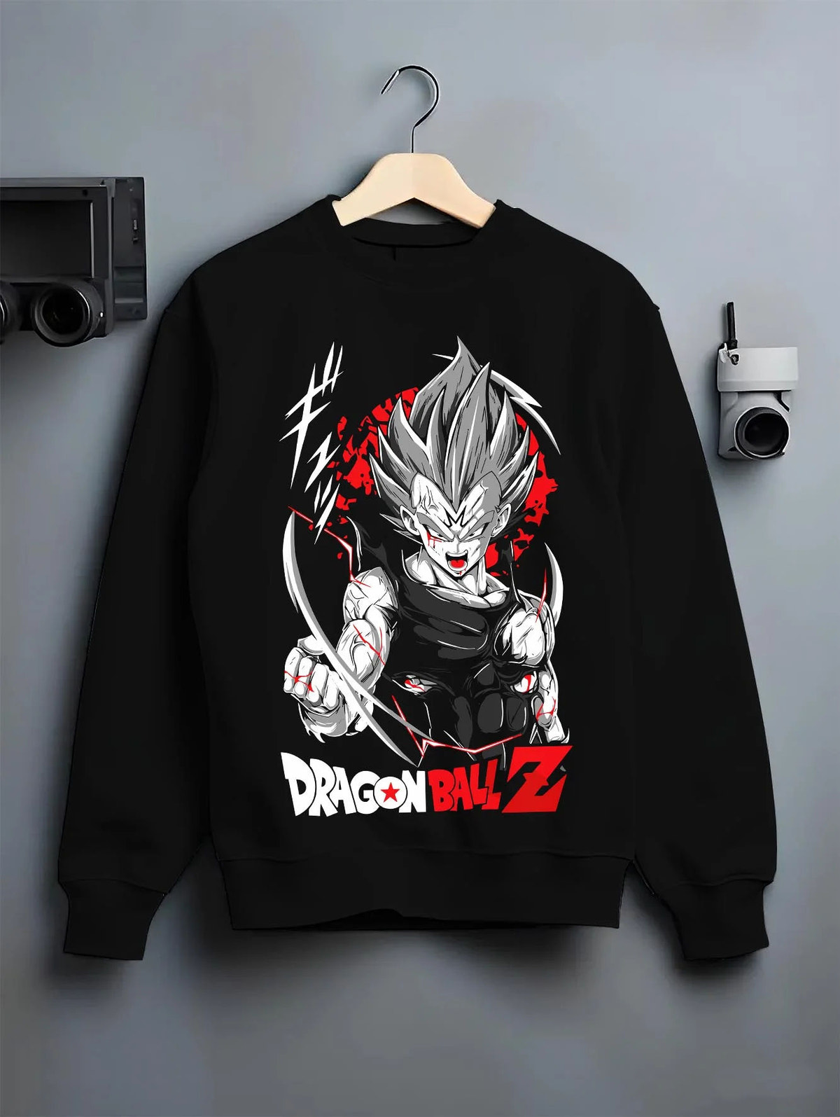 Black crewneck sweatshirt on hanger featuring Vegeta Ultra Ego God of Destruction power Dragon Ball Super artwork.