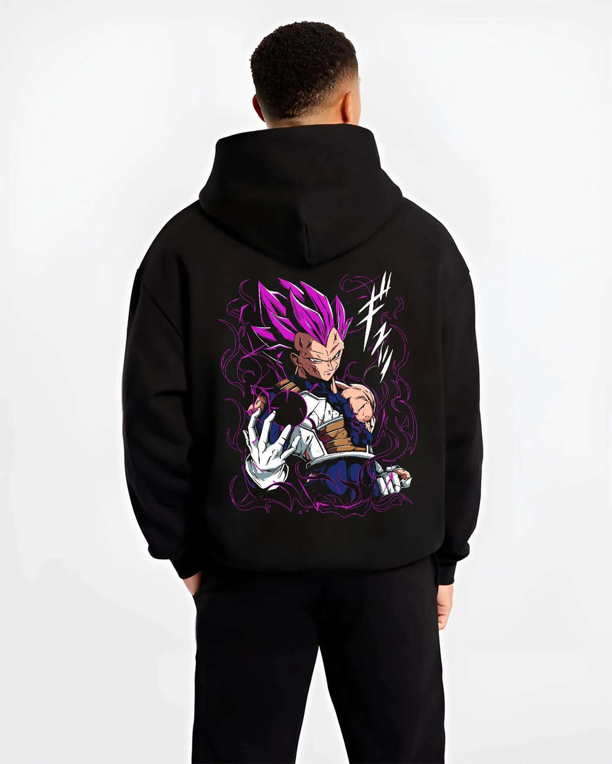 Black hoodie worn by male model from the back featuring Vegeta Ultra Ego purple aura battle Dragon Ball Super artwork.