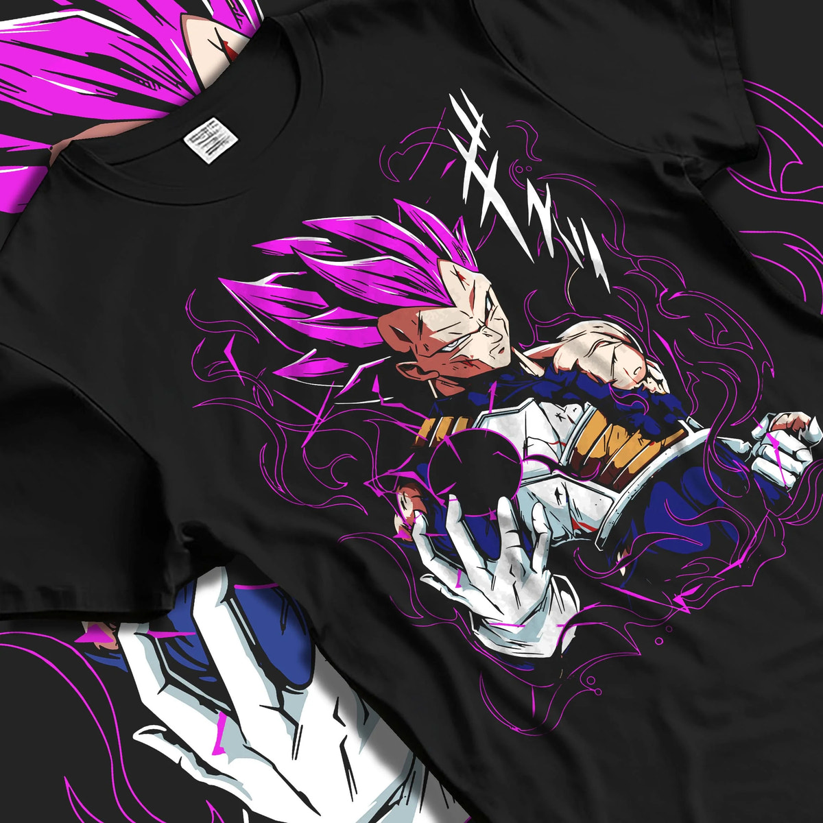 Black T-shirt laid flat with natural folds featuring Vegeta Ultra Ego purple aura battle Dragon Ball Super artwork.