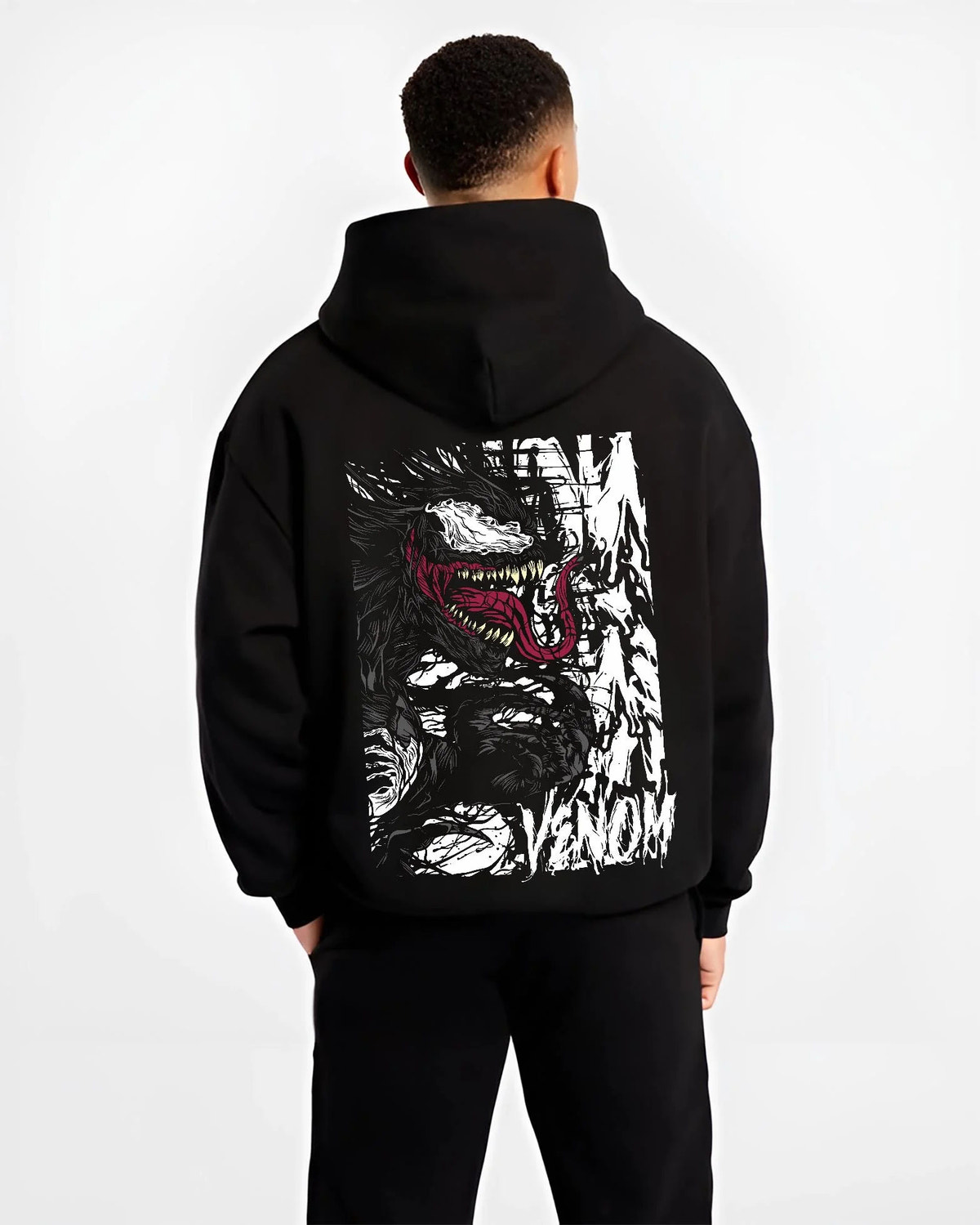 Black hoodie worn by male model from the back featuring Venom white symbiote monster portrait Marvel artwork.