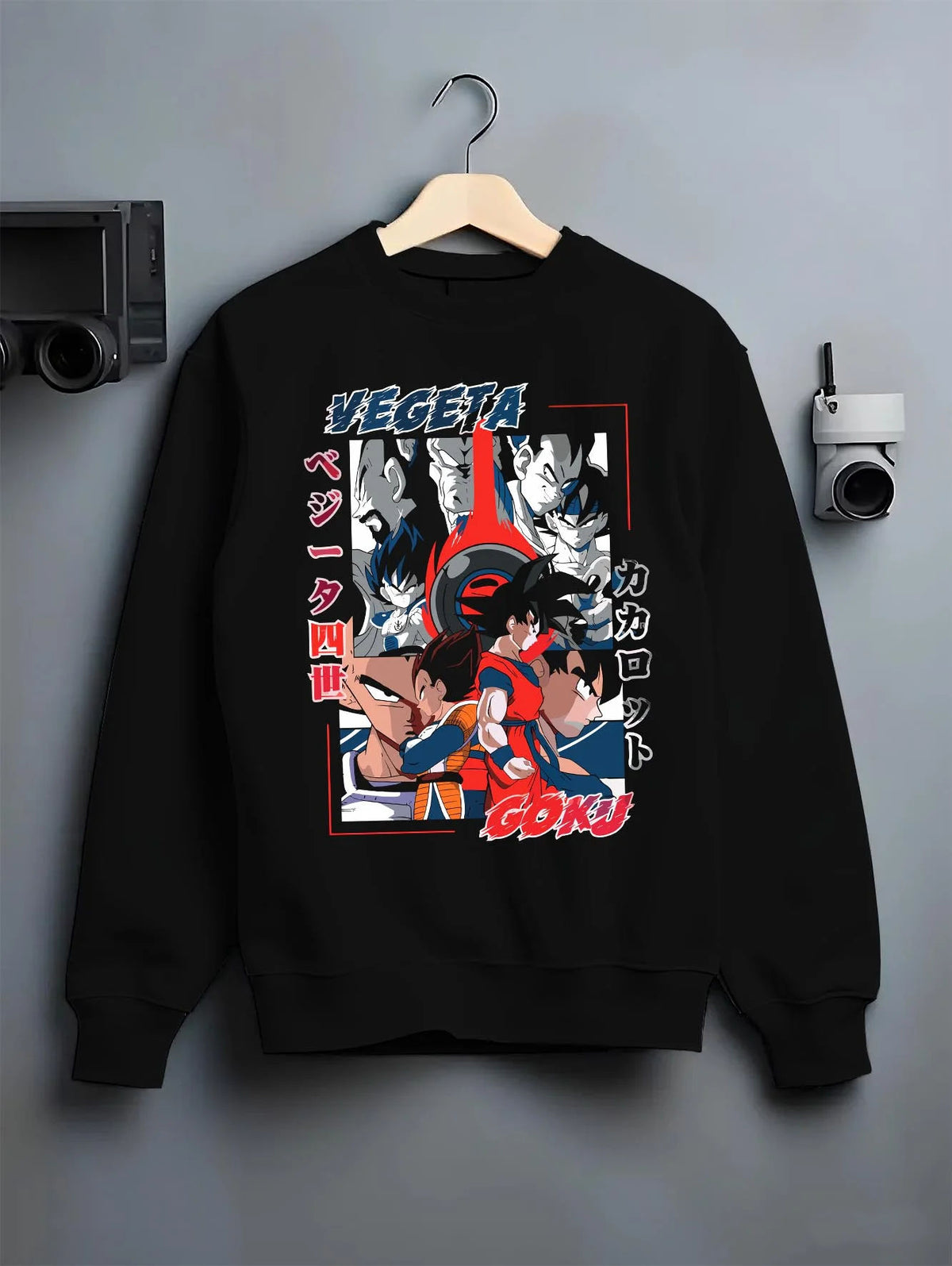 Black crewneck sweatshirt on hanger featuring Vegeta and Goku Saiyan rival clash Dragon Ball artwork.