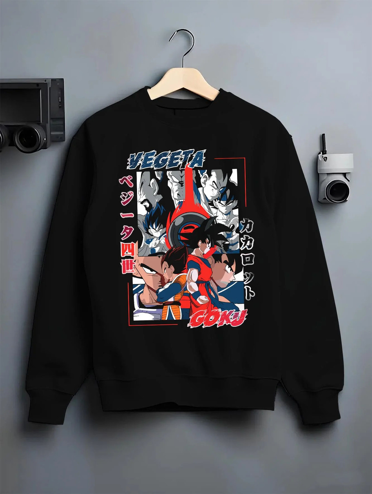 Black crewneck sweatshirt on hanger featuring Vegeta and Goku Saiyan rival clash Dragon Ball artwork.