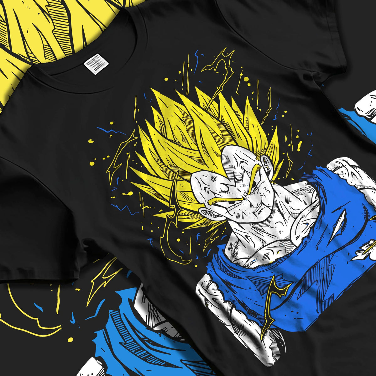 Black T-shirt laid flat with natural folds featuring Majin Vegeta battle-worn Saiyan Dragon Ball Z artwork.