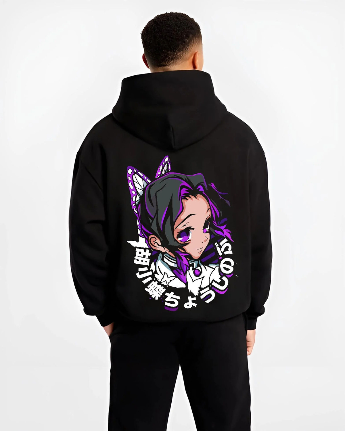 Black hoodie worn by male model from the back featuring Shinobu Kocho Butterfly Hashira portrait Demon Slayer artwork.