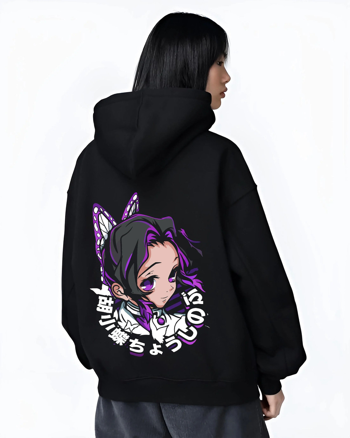 Black hoodie worn by female model from the back featuring Shinobu Kocho Butterfly Hashira portrait Demon Slayer artwork.