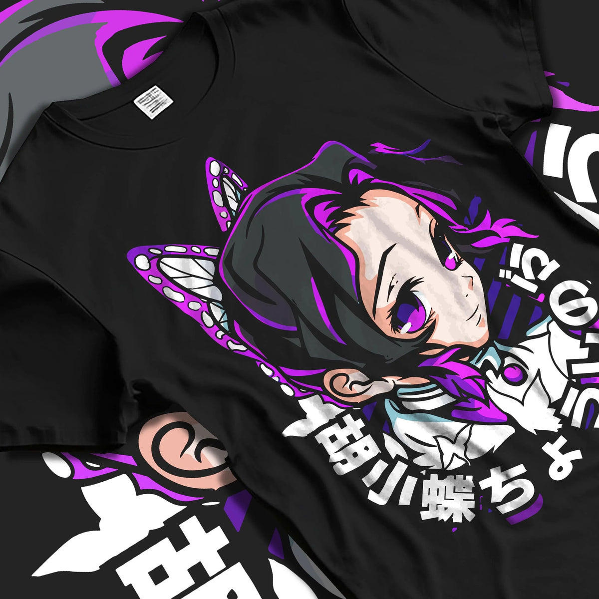 Black T-shirt laid flat with natural folds featuring Shinobu Kocho Butterfly Hashira portrait Demon Slayer artwork.