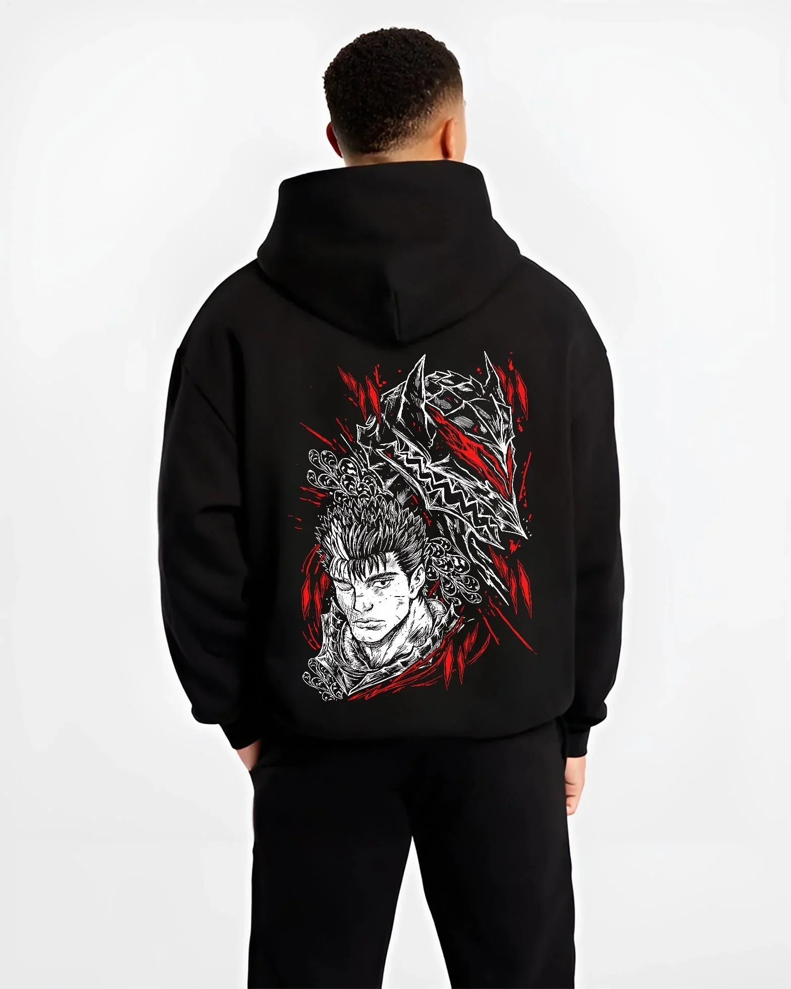 Black hoodie worn by male model, back view with Guts Berserk Hoodie Wolf Knight Dark Swordsman Anime graphic streetwear graphic.