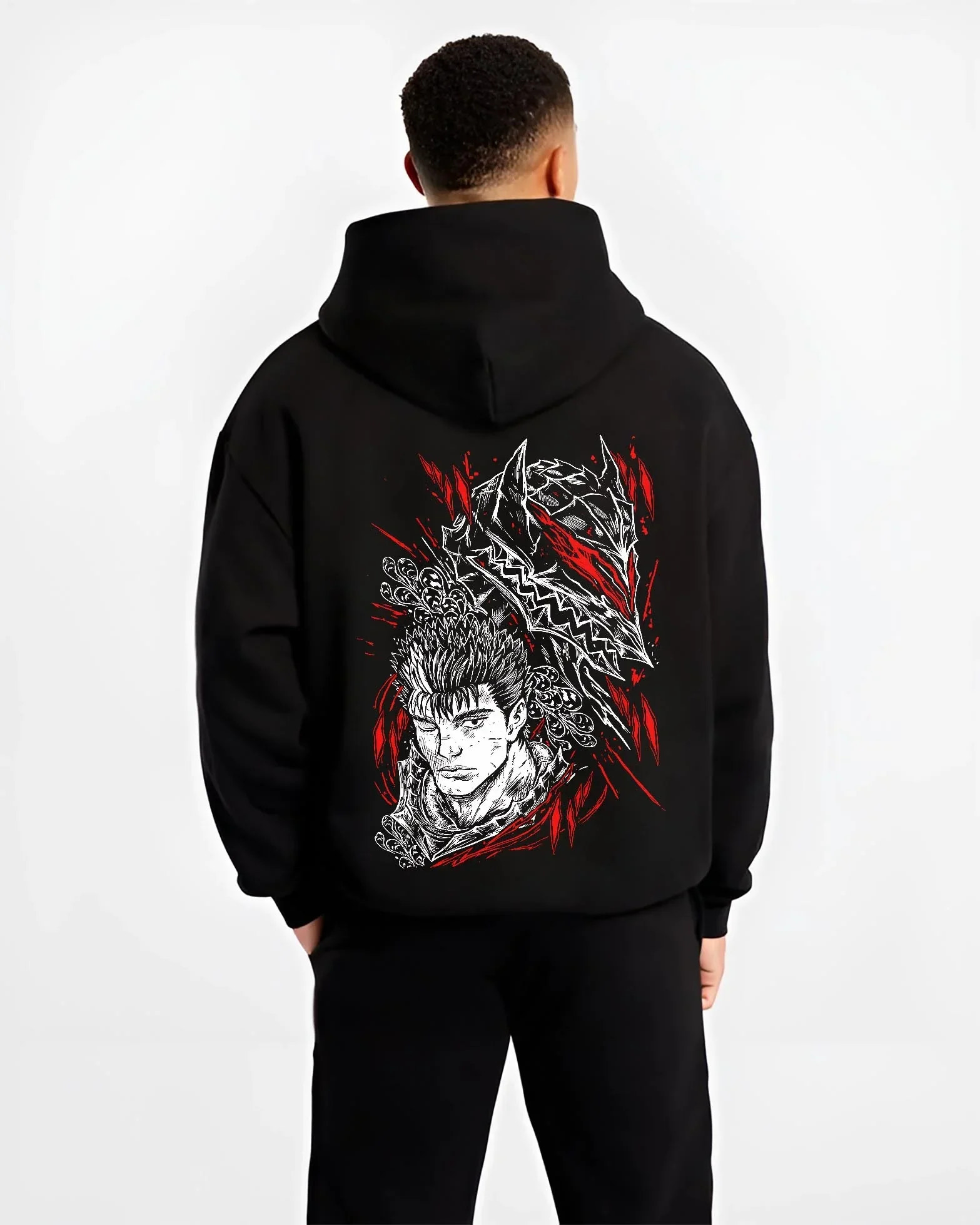 Black hoodie worn by male model, back view with Guts Berserk Hoodie Wolf Knight Dark Swordsman Anime graphic streetwear graphic.