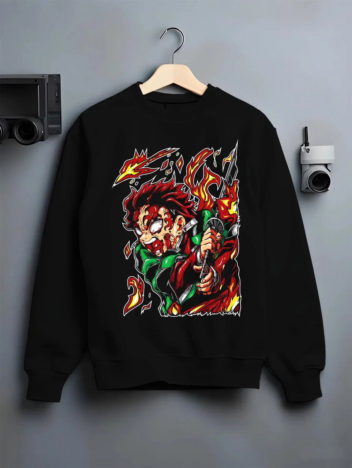 Black crewneck sweatshirt on hanger featuring Tanjiro Kamado Hinokami fire dragon Demon Slayer artwork.
