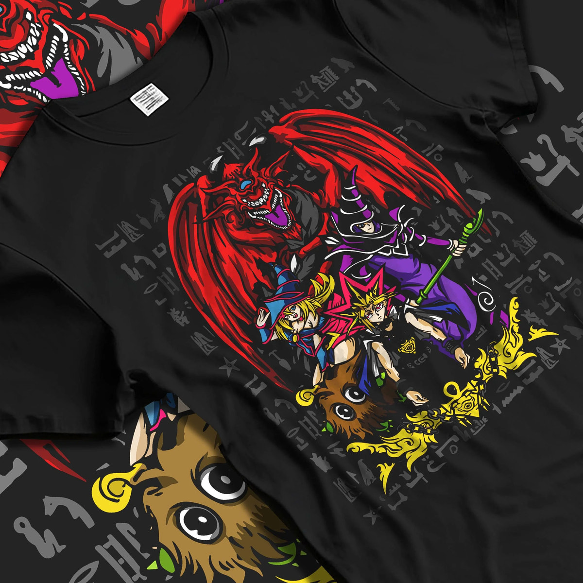 Black T-shirt laid flat with natural folds featuring Yugi Egyptian God Cards duel Yu-Gi-Oh! artwork.