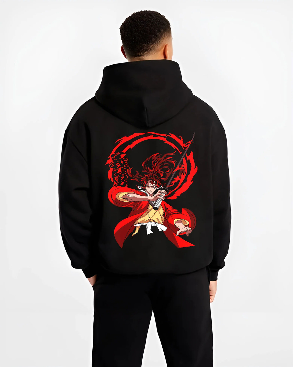 Black hoodie model back view showing Yoriichi Tsugikuni from Demon Slayer: red sun-breathing sword attack