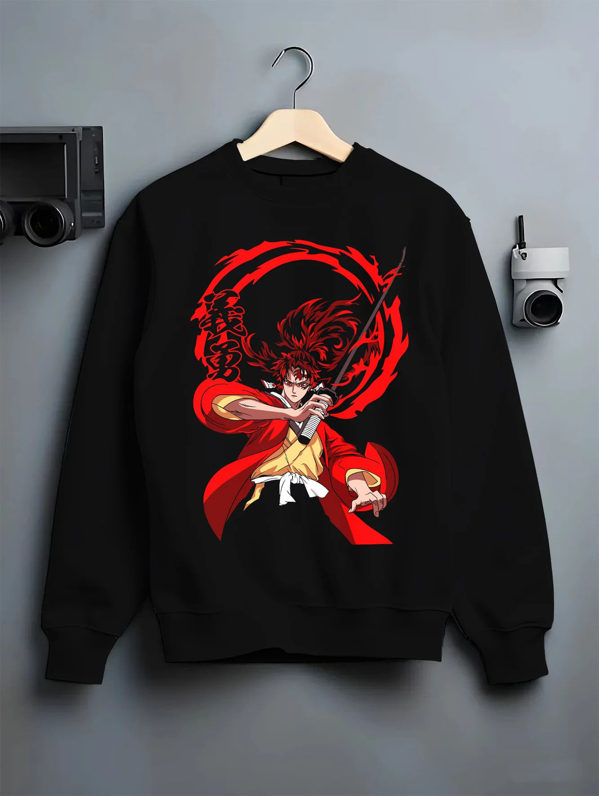 Black crewneck sweatshirt on hanger showing Yoriichi Tsugikuni from Demon Slayer: red sun-breathing sword attack