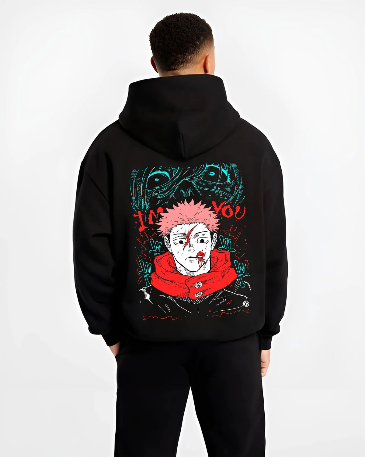 Black hoodie model back view showing Yuji Itadori / Sukuna from Jujutsu Kaisen: scarred face red scarf artwork