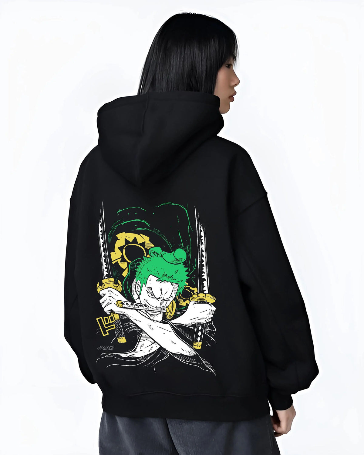 Black hoodie worn by female model from the back featuring Roronoa Zoro Santoryu green sword One Piece artwork.