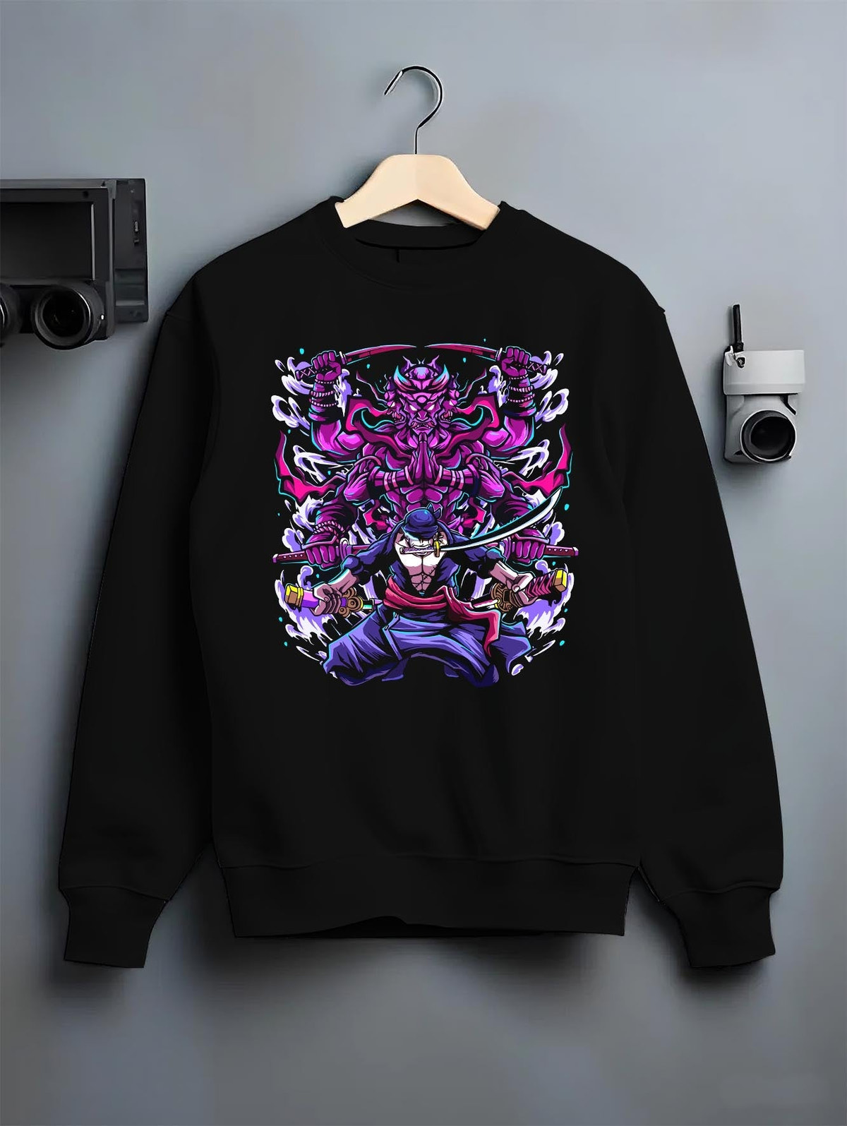 Black crewneck sweatshirt on a hanger against a grey wall, featuring Zoro Susanoo Japanese animation streetwear design with glowing purple shonen battle aura.
