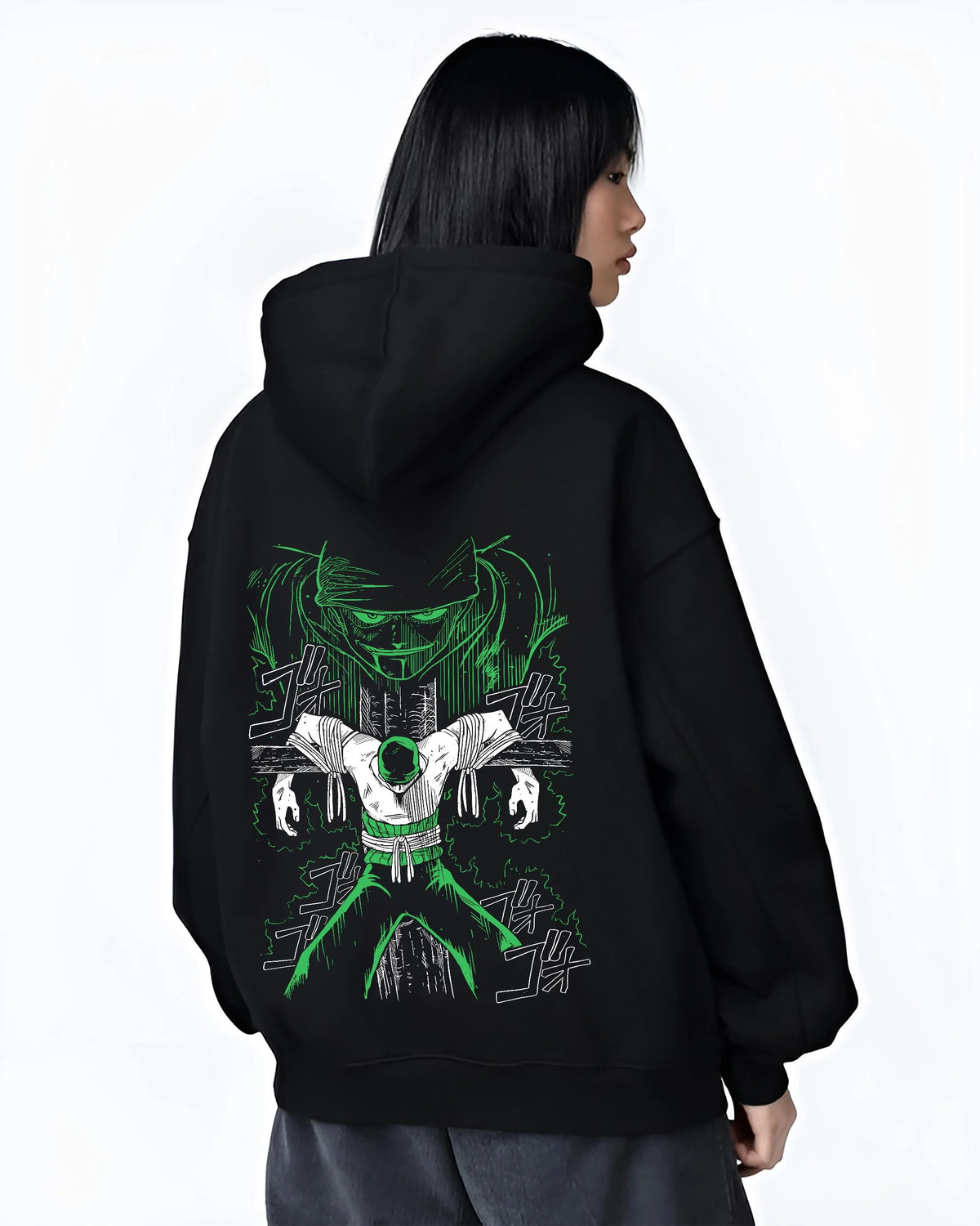Black hoodie worn by female model from the back featuring Roronoa Zoro swordsman portrait One Piece artwork.