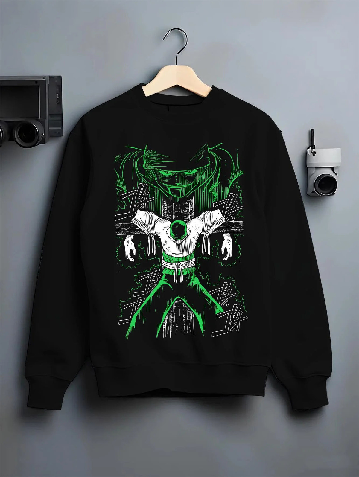 Black crewneck sweatshirt on hanger featuring Roronoa Zoro swordsman portrait One Piece artwork.