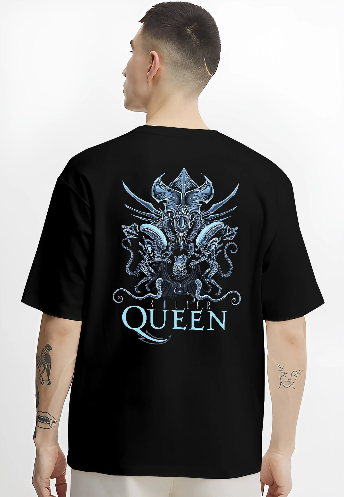 Black T-shirt on male model, back view, Alien Xenomorph Queen “Killer Queen” retro sci-fi graphic with sharp biomechanical detailing and blue shine.