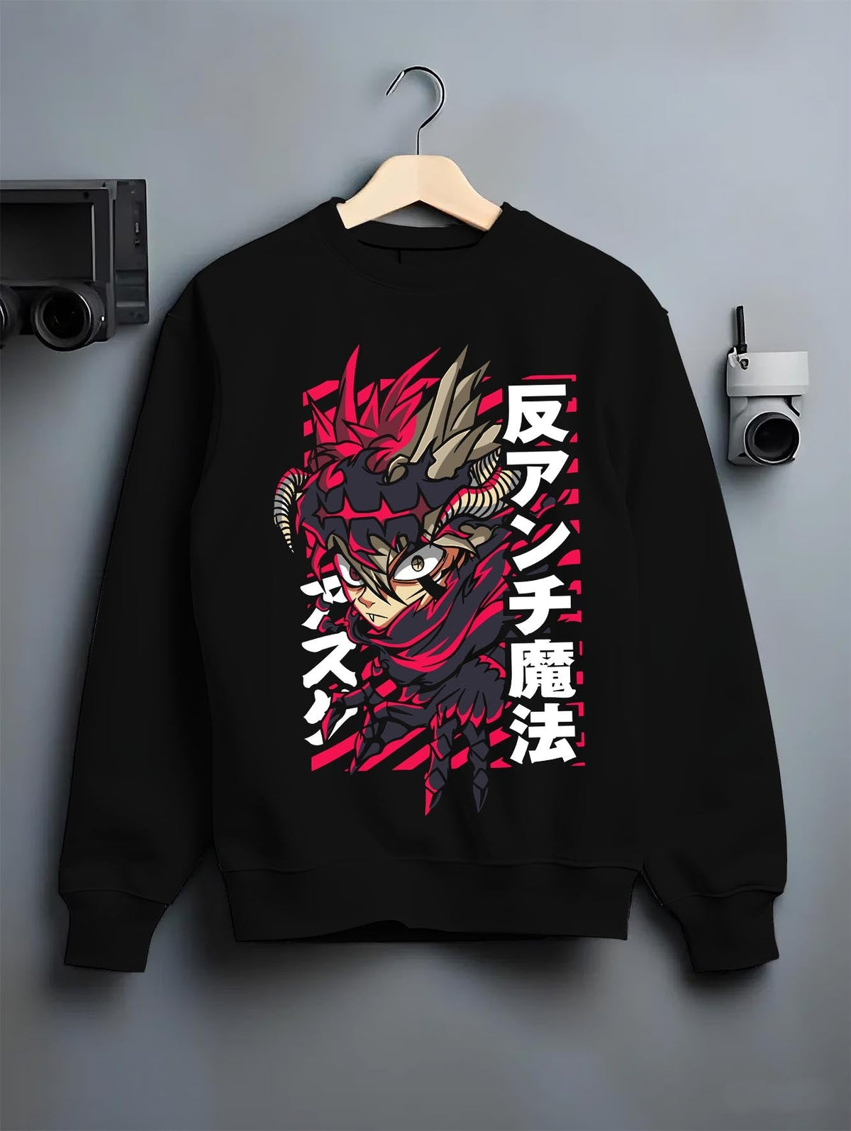 Black crewneck sweatshirt on a hanger against a grey wall, featuring Asta anti-magic retro manga design with fiery Japanese animation streetwear style.