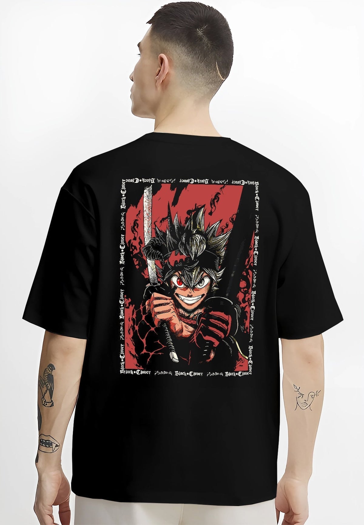 Black T-shirt worn by a male model, back view, featuring Asta Black Clover anime poster inspired shonen battle design with sword raised and fiery manga red aura.